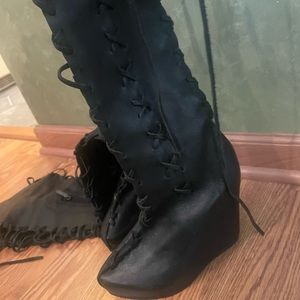 Black thigh high gypsy dharma boots with wedge heels